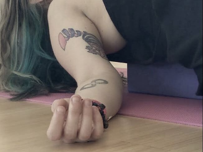 A person practicing gentle yoga online